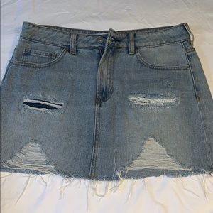 Ripped light wash denim skirt